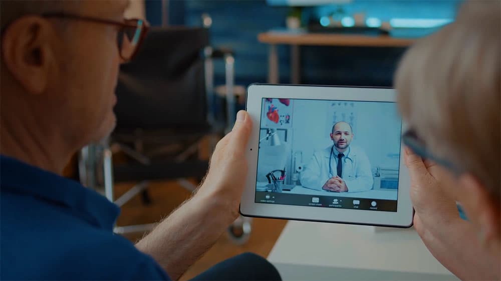 A worker consulting a Nexus Health physician over a video call